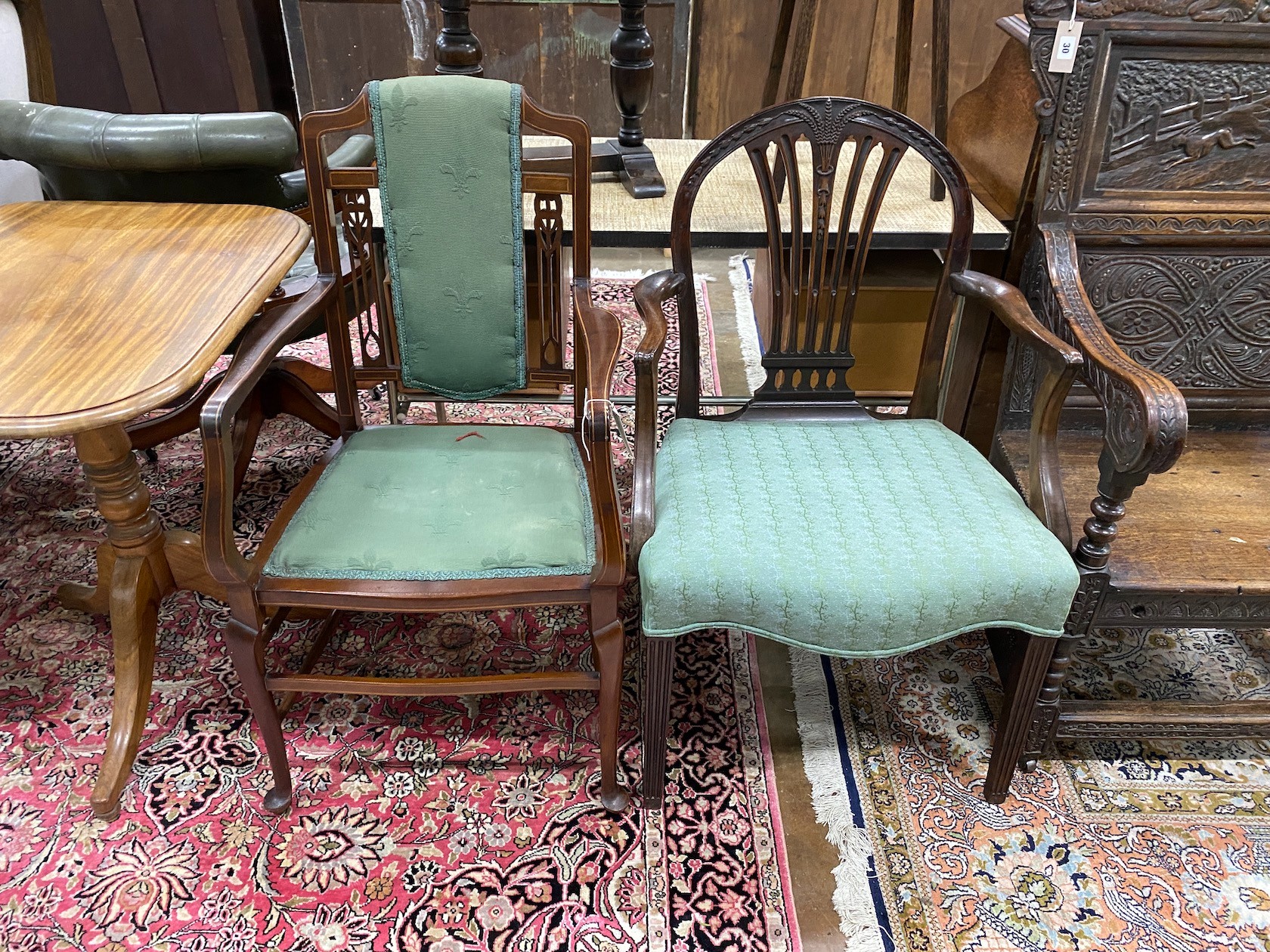 A George III mahogany inlaid elbow chair and an Edwardian mahogany elbow chair